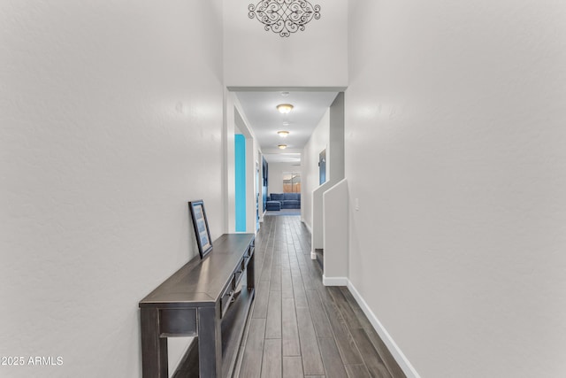 23886 W Harrison Dr, Buckeye, AZ 85326 - corridor featuring dark wood-style floors and baseboards