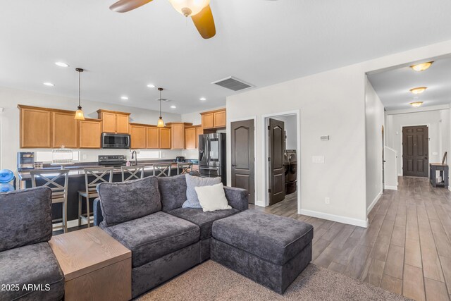 23886 W Harrison Dr, Buckeye, AZ 85326 - living room with ceiling fan, wood finished floors, and recessed lighting
