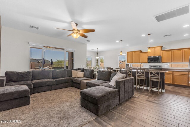 23886 W Harrison Dr, Buckeye, AZ 85326 - living room with a ceiling fan, dark wood-type flooring, and recessed lighting