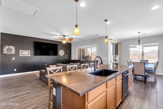 23886 W Harrison Dr, Buckeye, AZ 85326 - kitchen featuring dark wood finished floors, recessed lighting, ceiling fan, an island with sink, and an accent wall