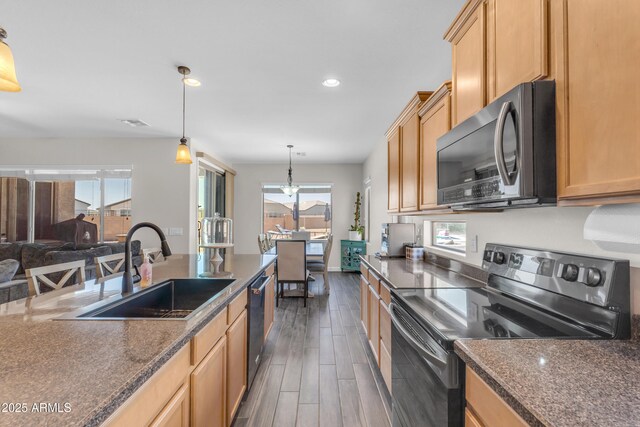 23886 W Harrison Dr, Buckeye, AZ 85326 - kitchen featuring appliances with stainless steel finishes, dark wood finished floors, recessed lighting, decorative light fixtures, and light brown cabinetry