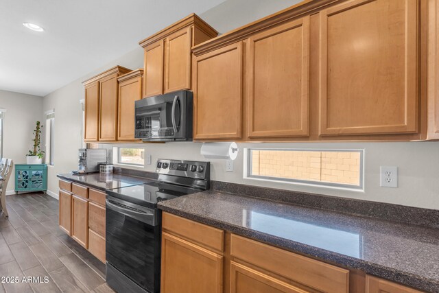 23886 W Harrison Dr, Buckeye, AZ 85326 - kitchen featuring stainless steel electric stove, dark wood-style floors, recessed lighting, and dark stone counters