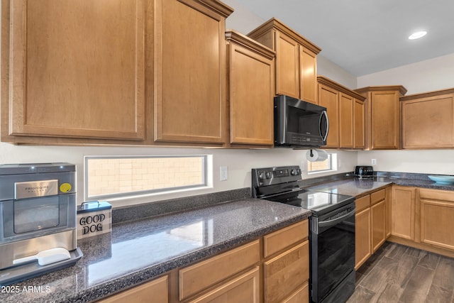 23886 W Harrison Dr, Buckeye, AZ 85326 - kitchen with black appliances, recessed lighting, and dark stone counters