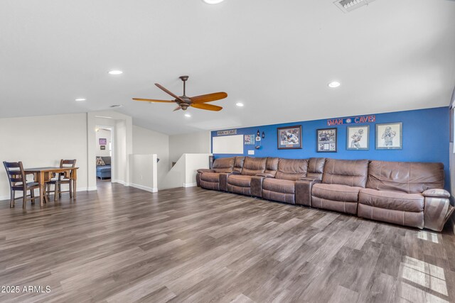 23886 W Harrison Dr, Buckeye, AZ 85326 - living area with lofted ceiling, ceiling fan, wood finished floors, and recessed lighting