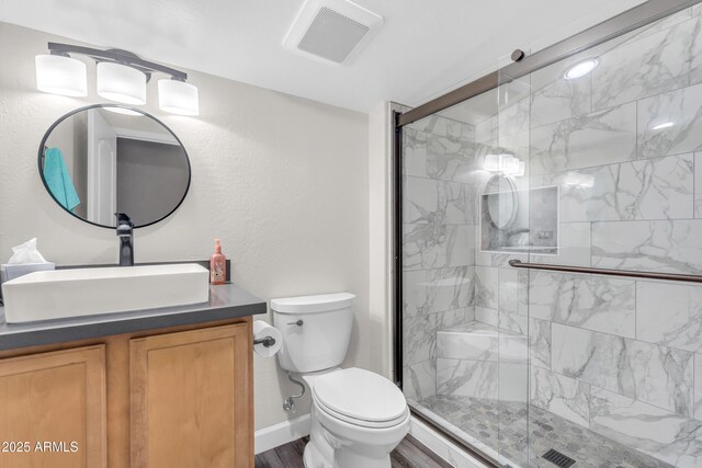 23886 W Harrison Dr, Buckeye, AZ 85326 - bathroom featuring vanity, a shower stall, and wood finished floors