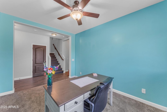23886 W Harrison Dr, Buckeye, AZ 85326 - office area with dark colored carpet and a ceiling fan