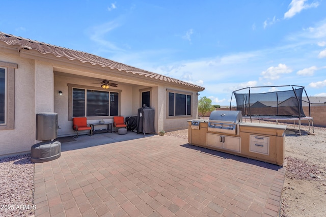 23886 W Harrison Dr, Buckeye, AZ 85326 - view of patio / terrace with a trampoline, grilling area, and a ceiling fan