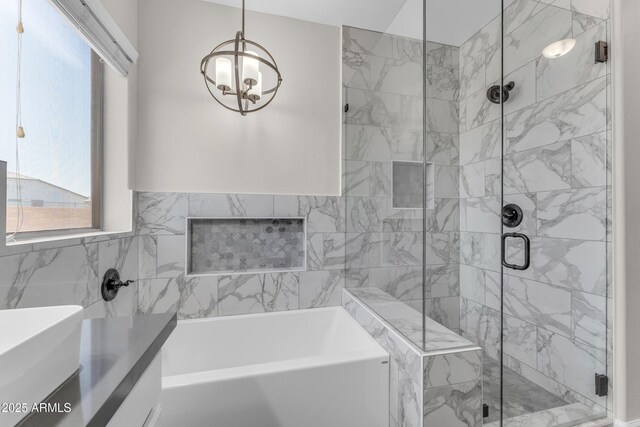 23886 W Harrison Dr, Buckeye, AZ 85326 - full bath with a bath, a stall shower, a chandelier, and vanity