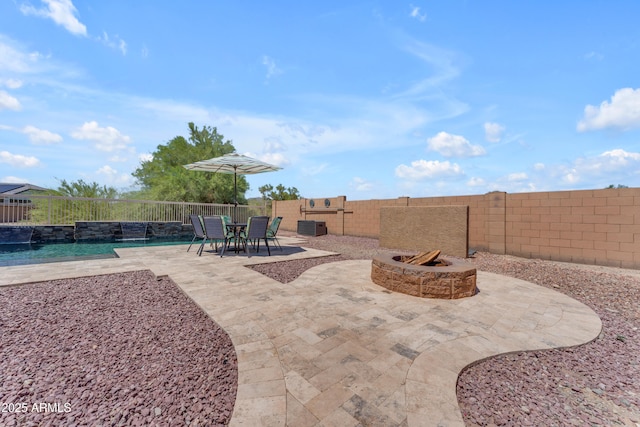 23886 W Harrison Dr, Buckeye, AZ 85326 - fenced backyard with a patio and a fire pit