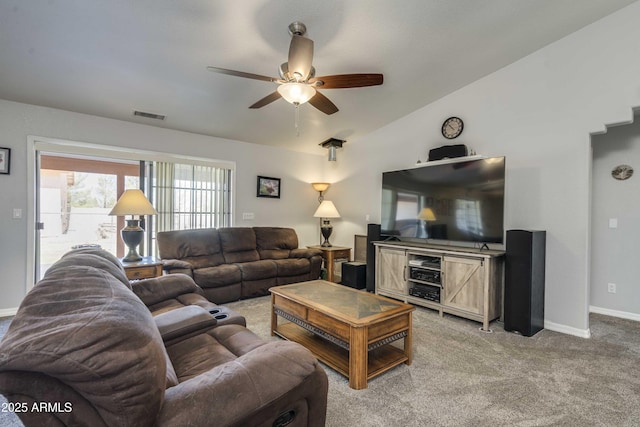 living area with light carpet, baseboards, visible vents, lofted ceiling, and ceiling fan