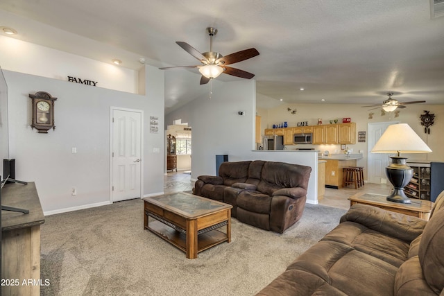 living room with light colored carpet, visible vents, ceiling fan, high vaulted ceiling, and baseboards