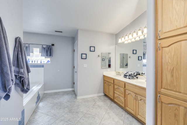 bathroom with tile patterned flooring, a sink, visible vents, baseboards, and double vanity