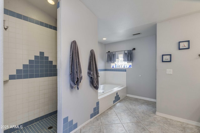 bathroom with visible vents, baseboards, tiled shower, a garden tub, and tile patterned flooring