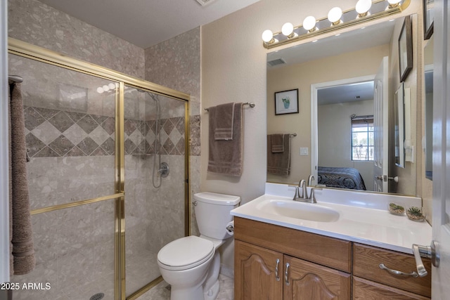 bathroom featuring visible vents, toilet, ensuite bathroom, vanity, and a shower stall