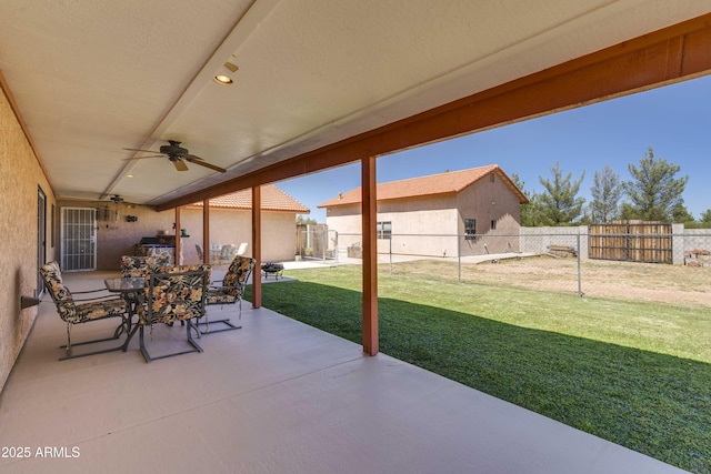 view of patio / terrace featuring ceiling fan, outdoor dining space, and a fenced backyard