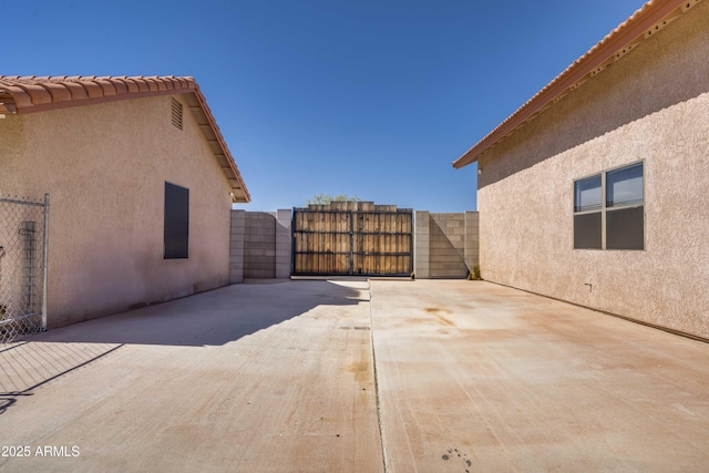 view of patio / terrace with a gate and fence