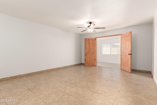 7340 W Meadowbrook Ave, Phoenix, AZ 85033 - empty room featuring a ceiling fan, baseboards, and light tile patterned floors