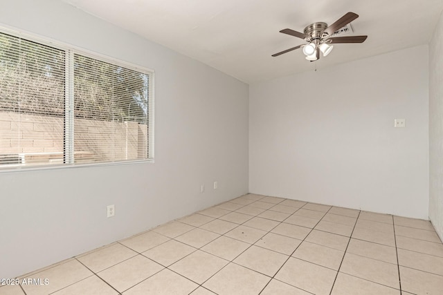 7340 W Meadowbrook Ave, Phoenix, AZ 85033 - spare room with a ceiling fan and light tile patterned flooring