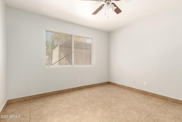 7340 W Meadowbrook Ave, Phoenix, AZ 85033 - unfurnished room with a ceiling fan, light tile patterned floors, and baseboards
