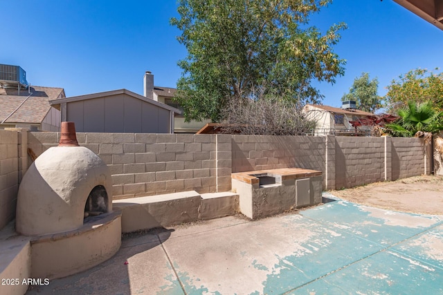 7340 W Meadowbrook Ave, Phoenix, AZ 85033 - view of patio featuring central AC unit
