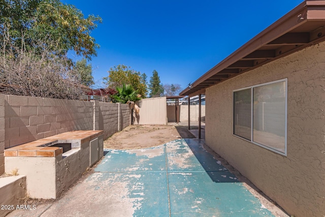 7340 W Meadowbrook Ave, Phoenix, AZ 85033 - fenced backyard featuring a patio area