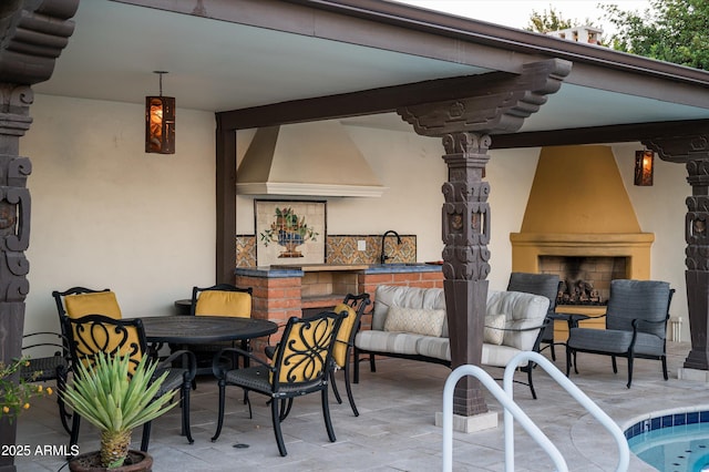 4316 N 40th St, Phoenix, AZ 85018 - view of patio / terrace with an outdoor fireplace and a sink