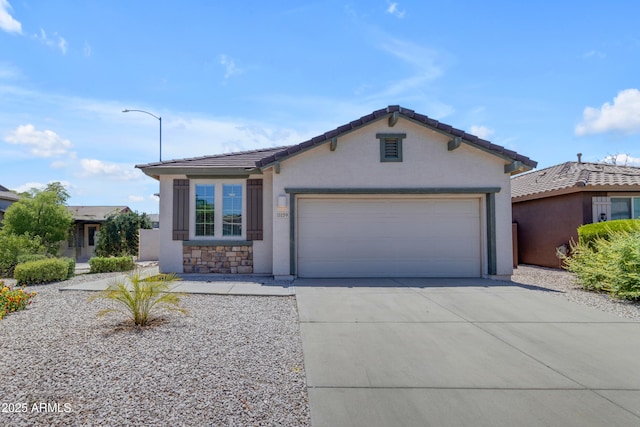 11159 E Sebring Ave, Mesa, AZ 85212 - view of front of house featuring concrete driveway, stucco siding, a garage, and a tiled roof