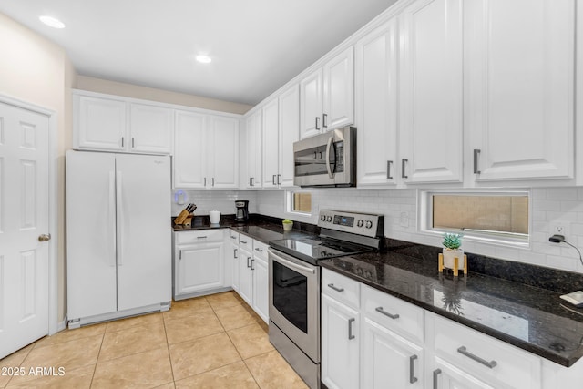 11159 E Sebring Ave, Mesa, AZ 85212 - kitchen with stainless steel appliances, backsplash, white cabinets, light tile patterned flooring, and recessed lighting