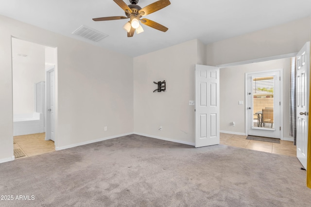 11159 E Sebring Ave, Mesa, AZ 85212 - unfurnished bedroom with carpet flooring, tile patterned flooring, ceiling fan, and ensuite bathroom