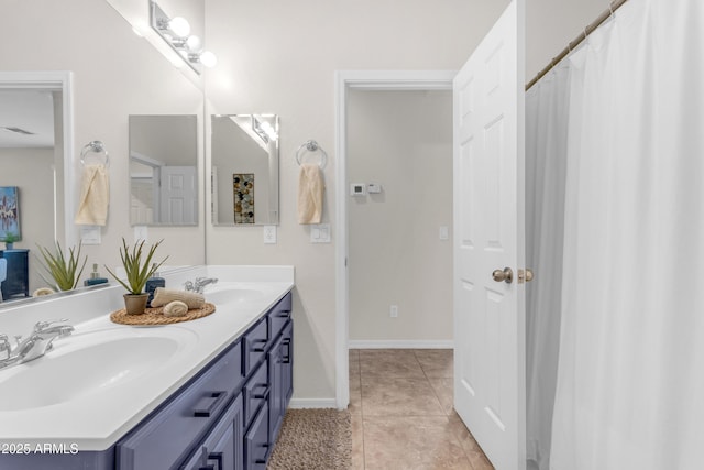 11159 E Sebring Ave, Mesa, AZ 85212 - bathroom featuring double vanity and tile patterned flooring
