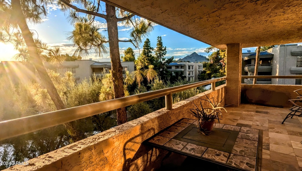 balcony with a water and mountain view