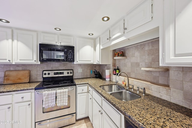 kitchen featuring black microwave, white cabinetry, a sink, and stainless steel range with electric cooktop