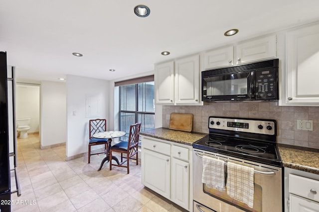kitchen with stainless steel electric range, backsplash, black microwave, and white cabinetry
