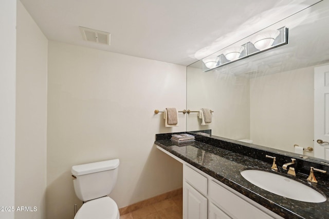 bathroom with visible vents, tile patterned flooring, vanity, baseboards, and toilet