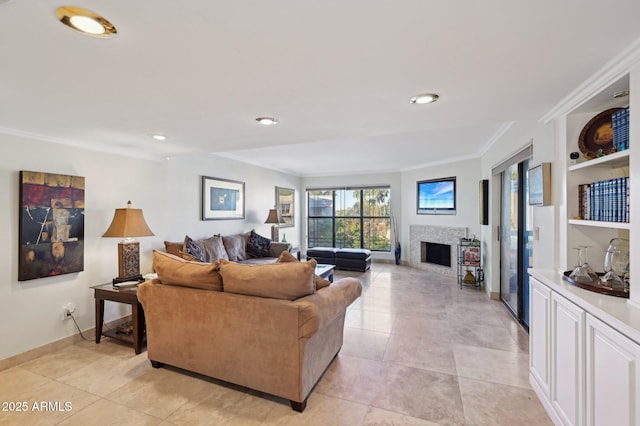 5122 N 31st Way Unit 244, Phoenix, AZ 85016 - living area with a fireplace, crown molding, light tile patterned flooring, recessed lighting, and built in shelves