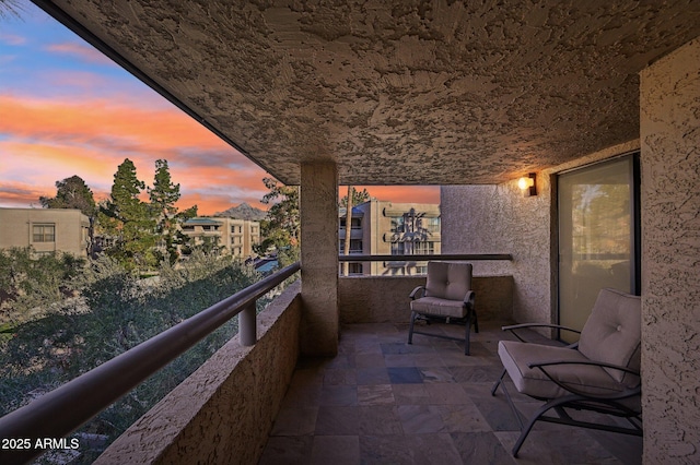 view of balcony at dusk