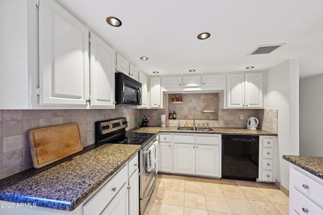 kitchen featuring visible vents, tasteful backsplash, a sink, black appliances, and white cabinetry
