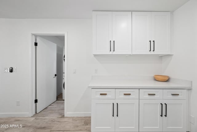 interior space featuring light countertops and white cabinets