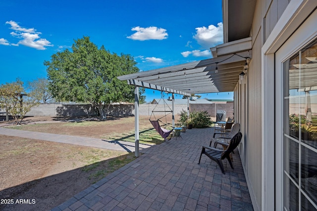 view of patio / terrace featuring a fenced backyard and a pergola