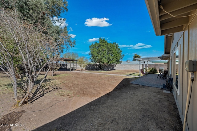 view of yard with a patio area, fence, and a gazebo