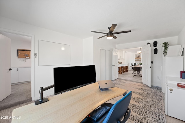 office space with a ceiling fan