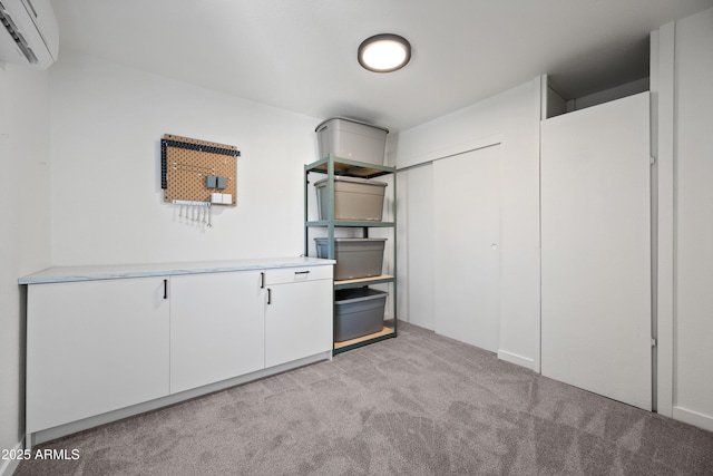 interior space featuring light carpet and an AC wall unit