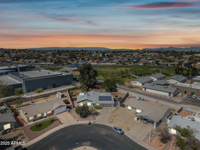 aerial view at dusk with a residential view and a mountain view