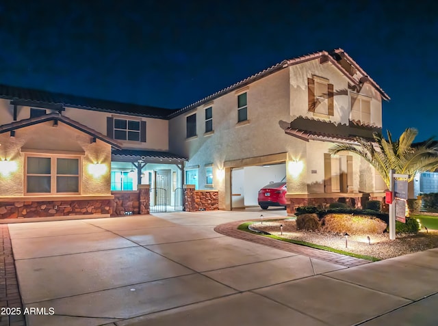 mediterranean / spanish-style home featuring a garage