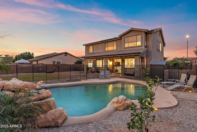 view of pool with a fenced backyard, a fenced in pool, and a patio