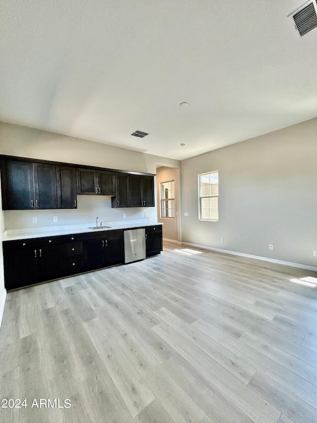 kitchen with light wood-type flooring and dishwasher