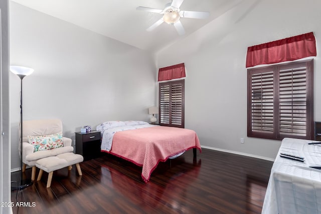 bedroom with vaulted ceiling, dark hardwood / wood-style flooring, and ceiling fan