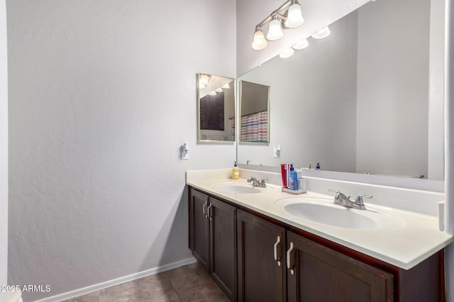 bathroom with vanity and tile patterned flooring