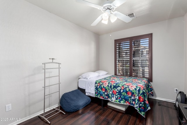 bedroom featuring wood-type flooring and ceiling fan