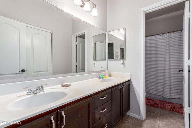 bathroom with tile patterned flooring, vanity, and a shower with shower curtain